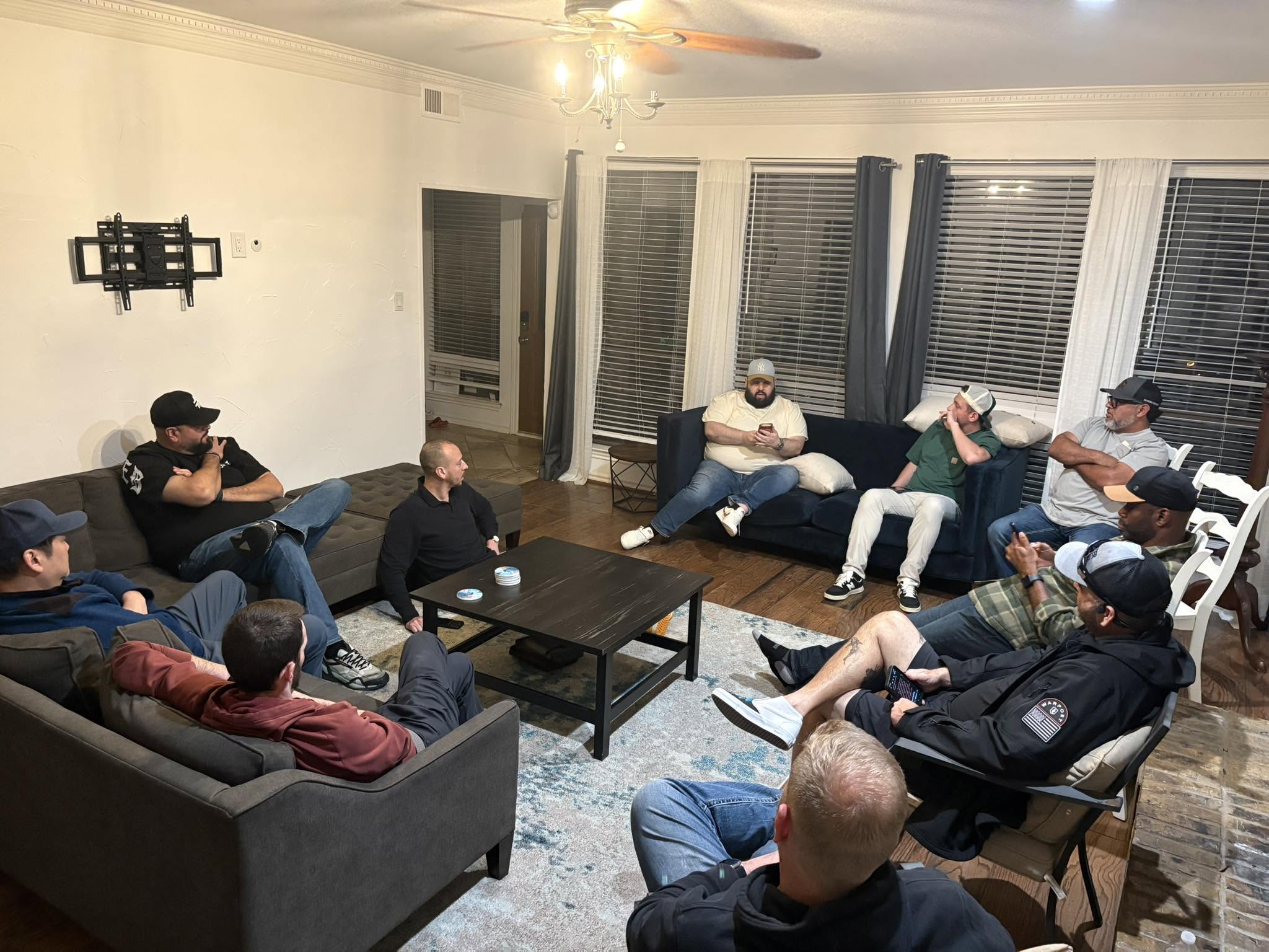 A living room full of men talking
