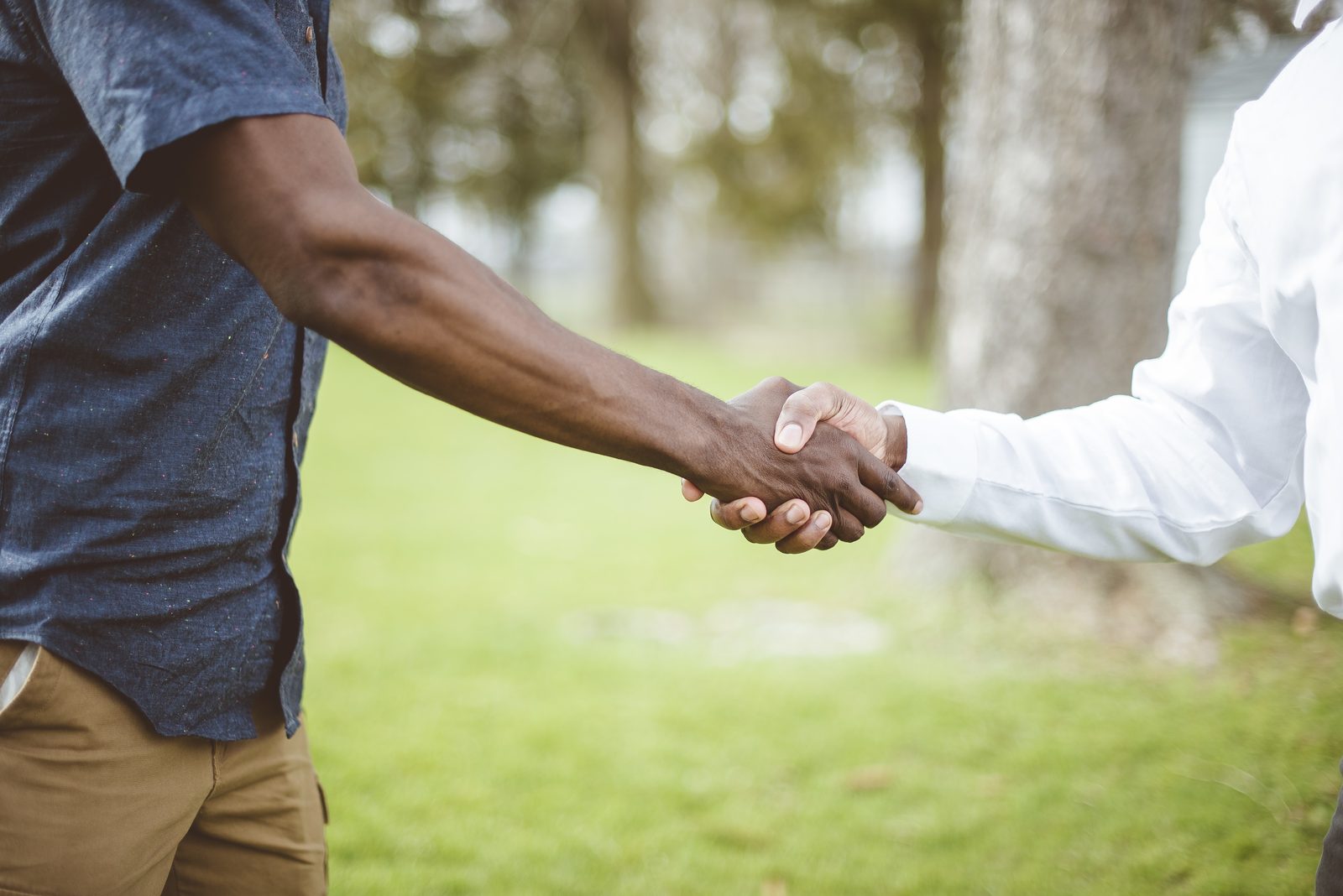 Two dads shaking hands